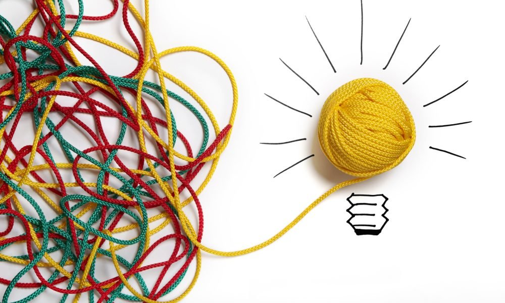Yellow ball of wool with pen lines like lightbulb